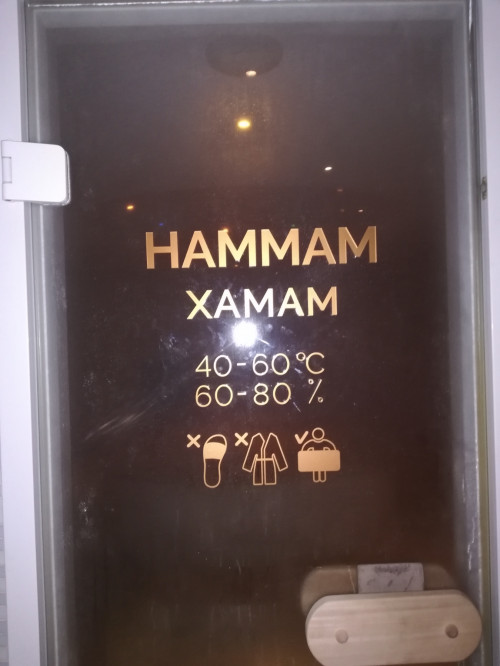 Sign on the door in the SPA for the company "Tsunami"