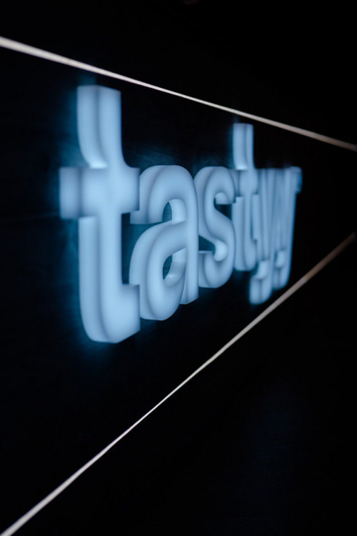 Signage for tastyy restaurant, Cologne, Germany 